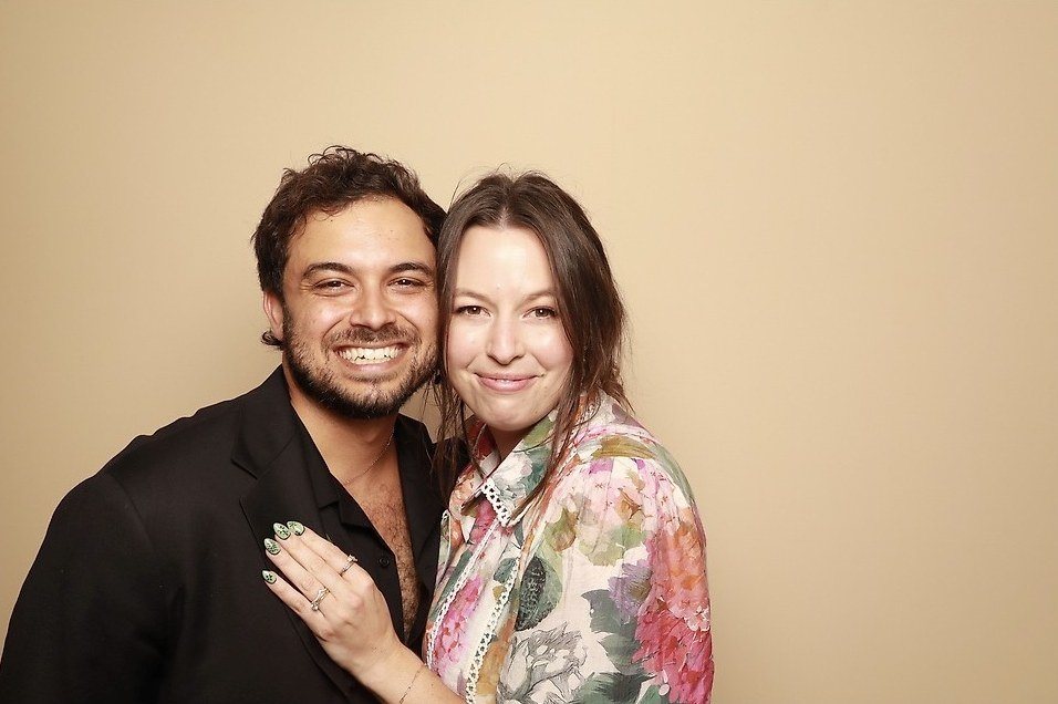 Sam and Isaac of Bloom Films smiling in a photo booth